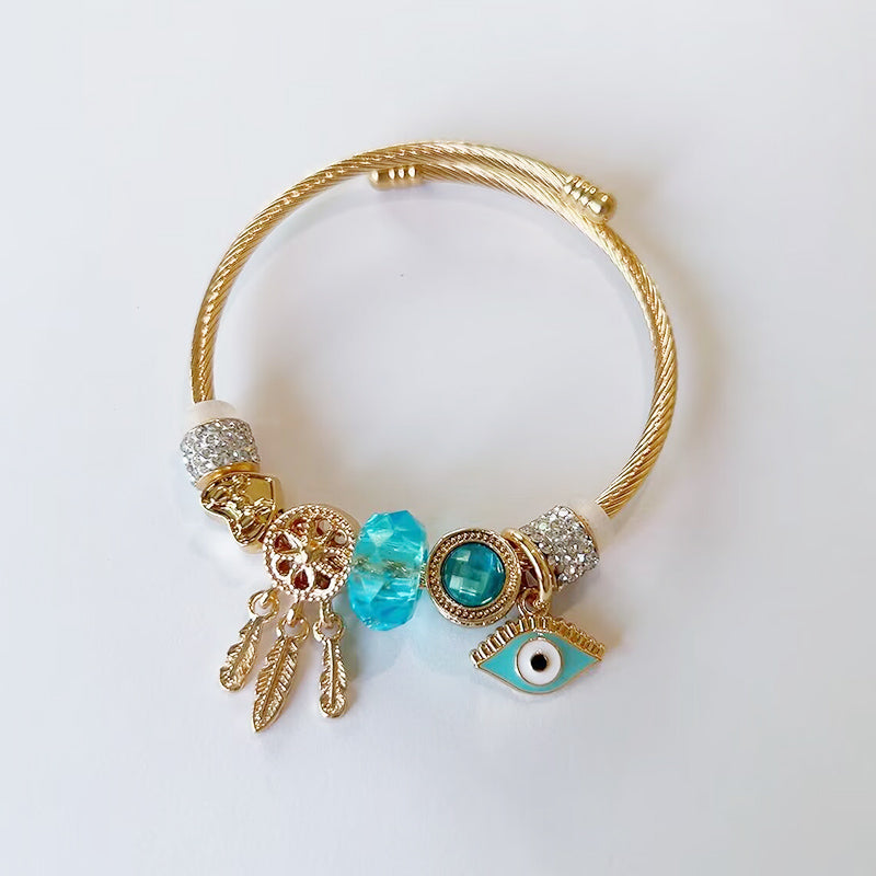 Gold Charm Bracelet – Emerald Crystal & Evil Eye